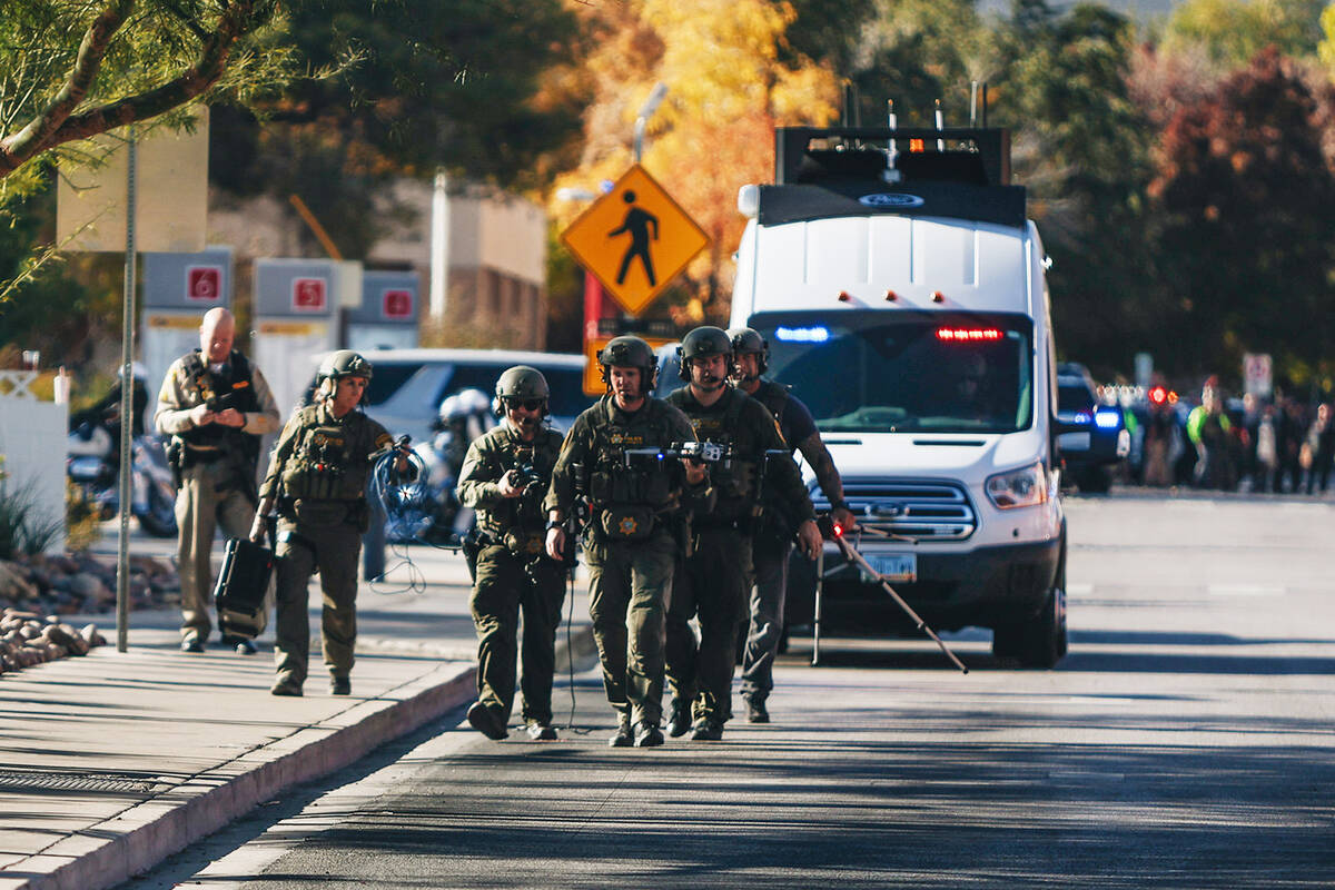 Police are seen at the scene of a shooting on the UNLV campus on Wednesday, Dec. 6, 2023, in La ...