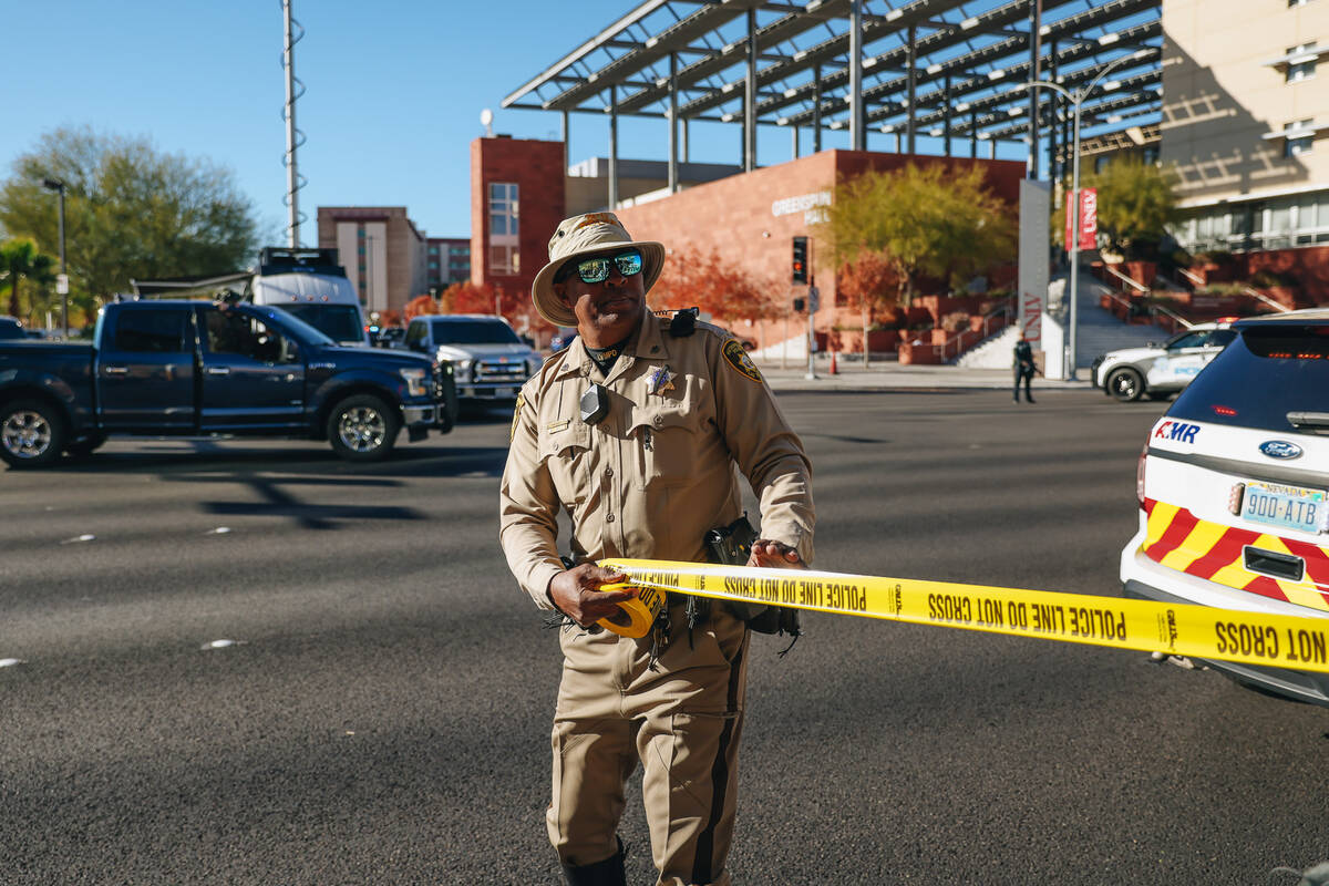 Police are seen at the scene of a shooting on the UNLV campus on Wednesday, Dec. 6, 2023, in La ...