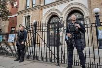 Hoboken Police officers stand watch outside the United Synagogue of Hoboken, Nov. 3, 2022, in H ...