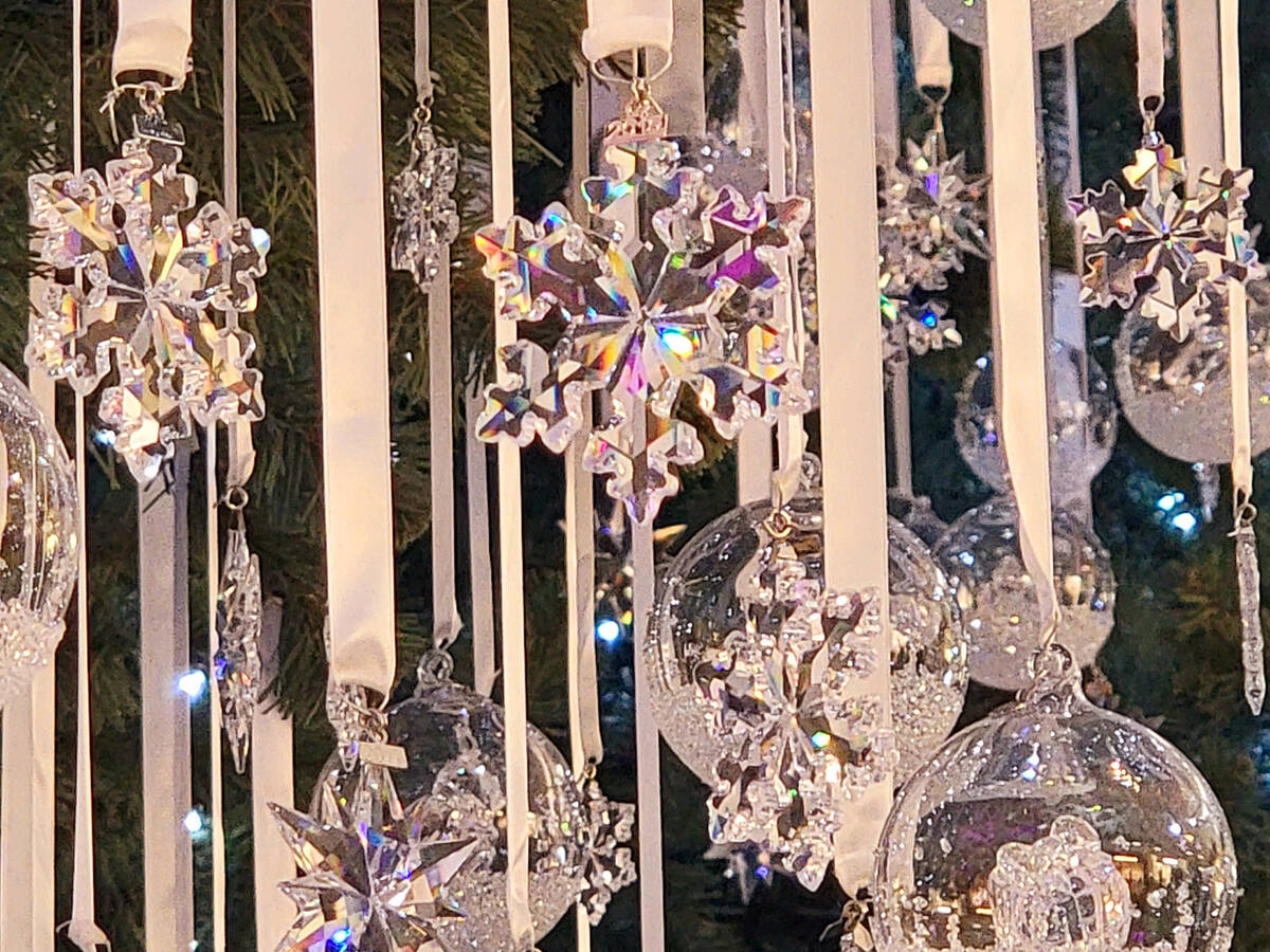 A close up of a few of the 5,000 Swarovski ornaments decorating a 55-foot Christmas tree at the ...