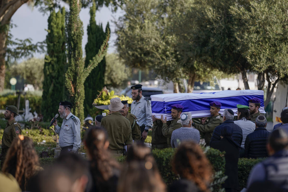 Israeli soldiers carry the coffin of reservist Master Sgt. Gil Daniels during his funeral in As ...