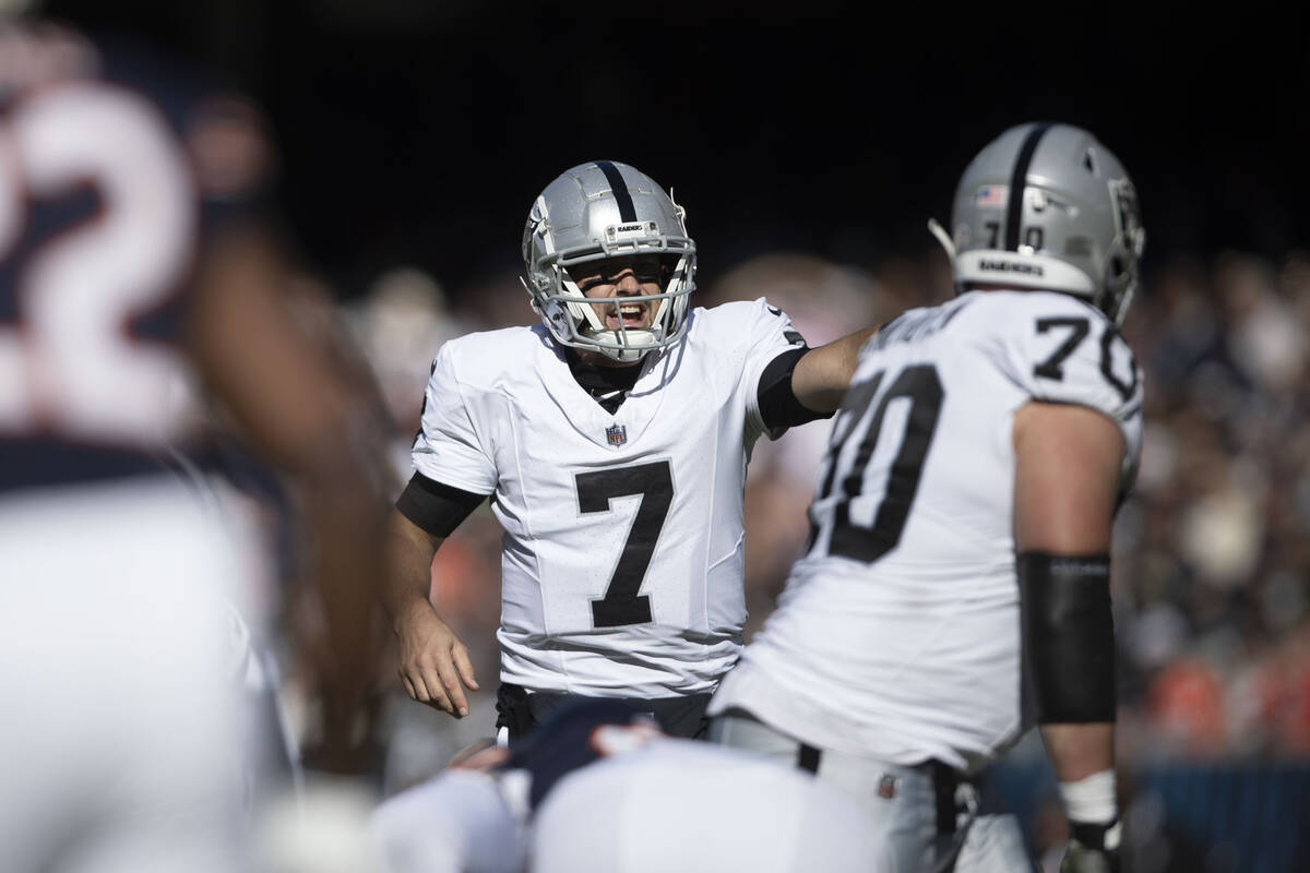 Raiders quarterback Brian Hoyer (7) audibles before a play during the second half an NFL game a ...