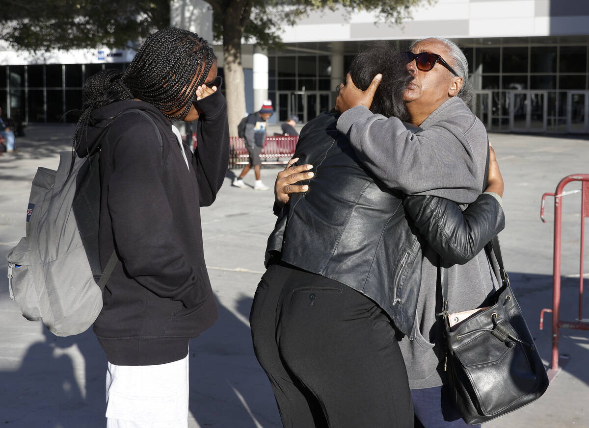 Nyssa Newman, center, a student and employee at the UNLV, reunites with her mother Monique Mitc ...