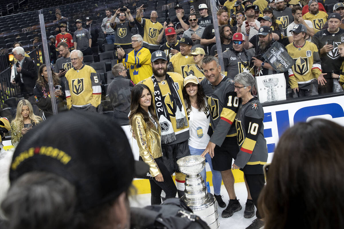 Golden Knights center Nicolas Roy (10) poses for a photo with his family and the Stanley Cup af ...