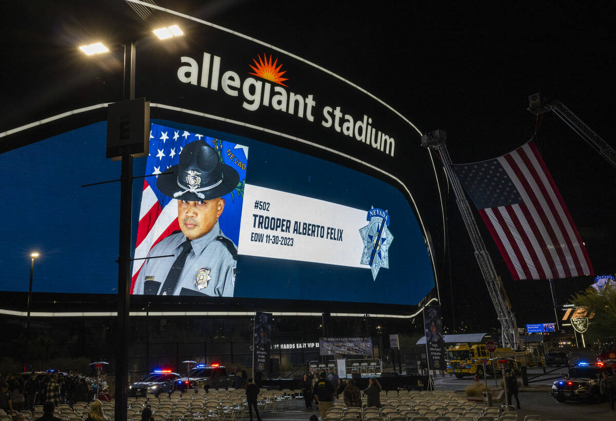 The large video screen shows a dedication to Nevada Highway Patrol trooper Alberto Felix at a c ...