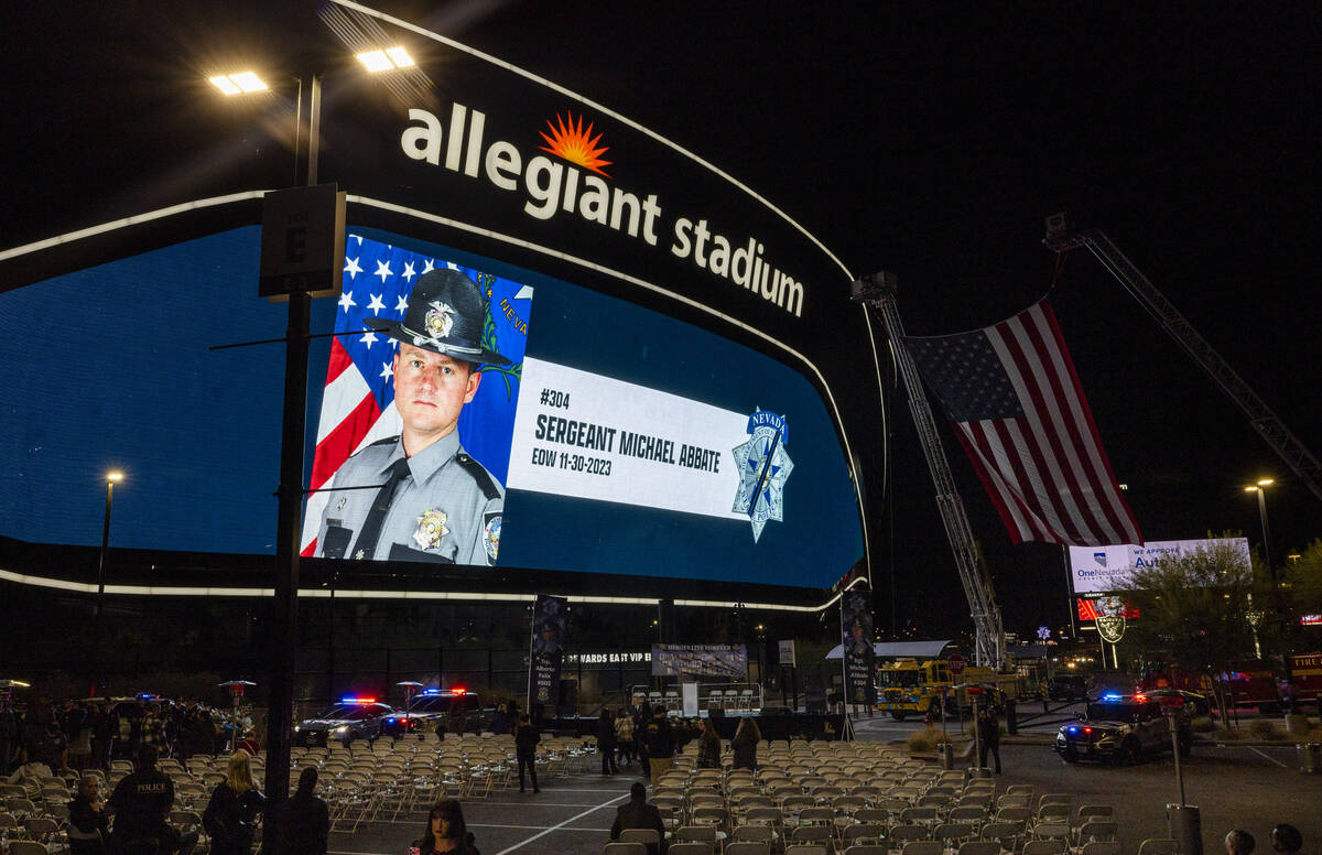 The large video screen shows a dedication to Nevada Highway Patrol Sgt. Michael Abbate at a can ...