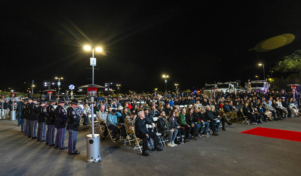 Family members and others gather during a candlelight vigil for Nevada Highway Patrol troopers ...