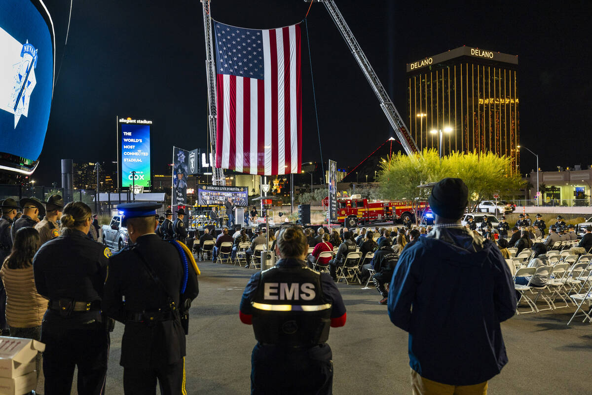 Numerous rescue personnel are on hand during a candlelight vigil for Nevada Highway Patrol troo ...