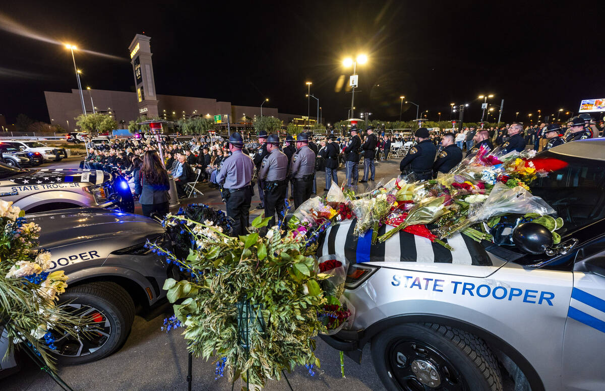 Numerous officers and rescue personnel gather during a candlelight vigil for Nevada Highway Pat ...