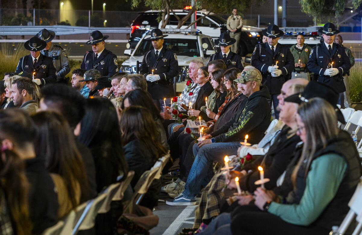 Family and supporters light candles during a candlelight vigil for Nevada Highway Patrol troope ...