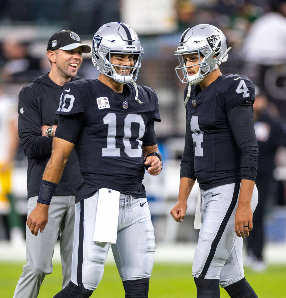 Raiders quarterback Jimmy Garoppolo (10) and quarterback Aidan O'Connell (4) warm up before fac ...