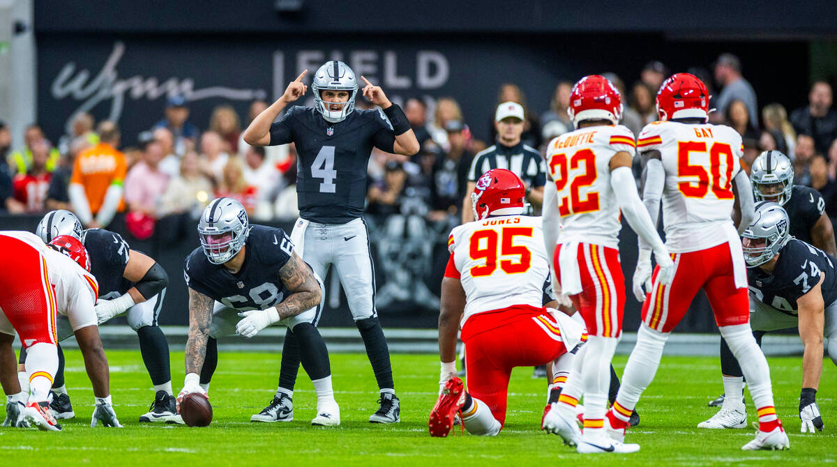 Raiders quarterback Aidan O'Connell (4) calls a play during the first half of their NFL game ag ...