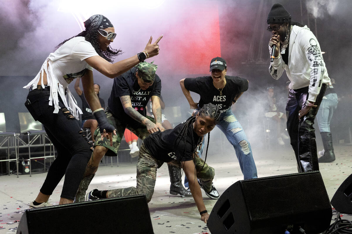 The Las Vegas Aces dance on stage with 2Chainz performance during a celebration of their WNBA b ...