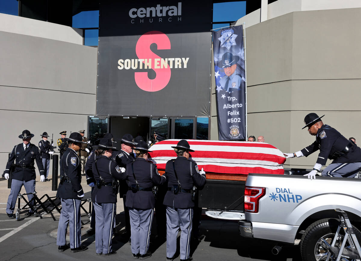 The casket carrying Nevada Highway Patrol trooper Alberto Felix is loaded at Central Church in ...