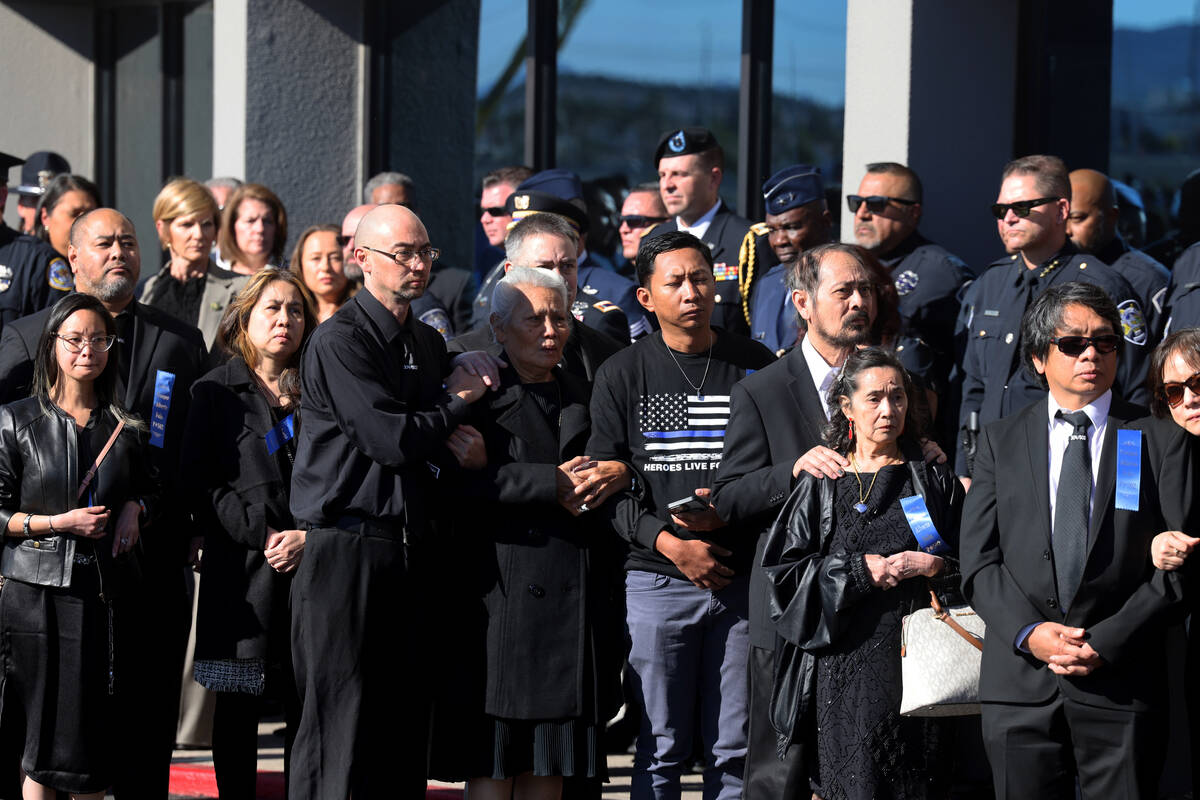 Loved ones watch as the casket is loaded for Nevada Highway Patrol trooper Alberto Felix during ...