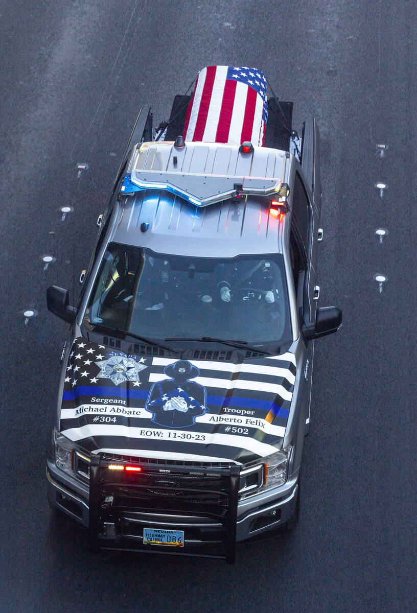 The casket of Nevada State Trooper Alberto Felix moves down the Las Vegas Strip during a proces ...