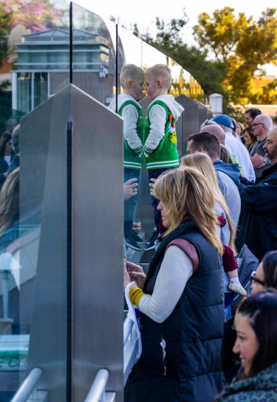 People watch from a pedestrian bridge during a procession for Nevada State Trooper Alberto Feli ...