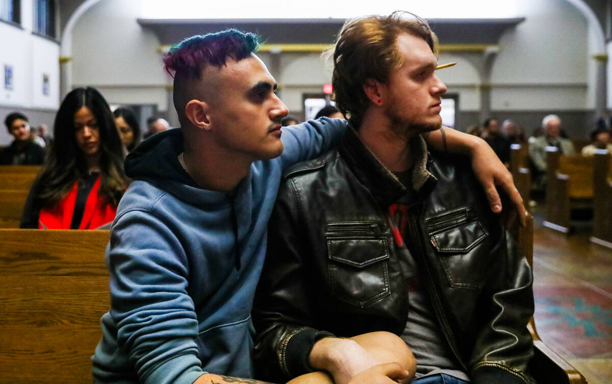 Angel Maiorano, left, and Thomas Levings, UNLV students, mourn at a community prayer held for t ...