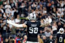 Raiders defensive end Maxx Crosby (98) directs fans to make noise during the second half of an ...