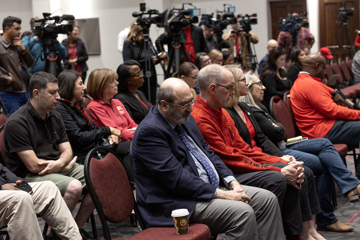UNLV staff and leadership listen to a news conference held in response to a Wednesday shooting ...