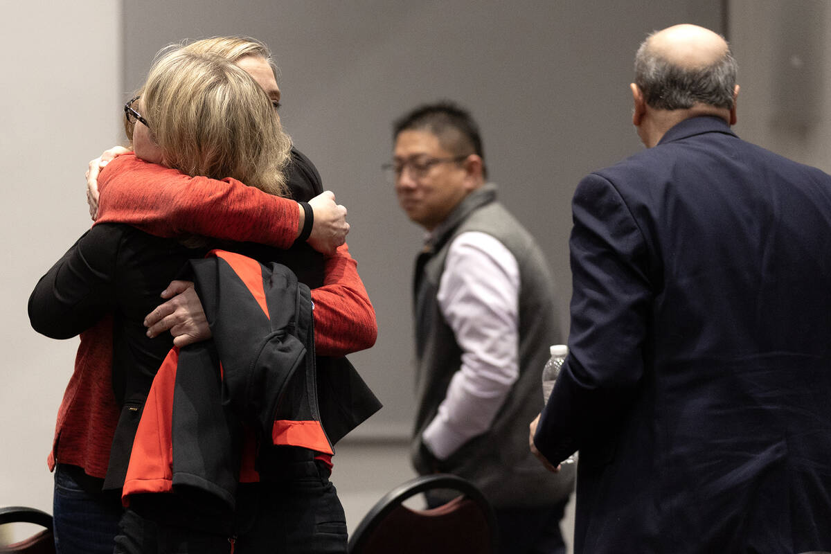 UNLV staff embraces after a news conference held in response to a Wednesday shooting at the uni ...