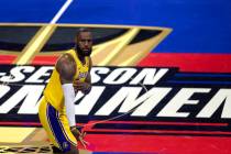Los Angeles Lakers forward LeBron James (23) celebrates after scoring during the first half of ...