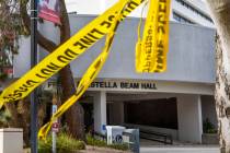 Police tape remains on a tree outside the entrance to the Frank and Estella Beam Hall following ...
