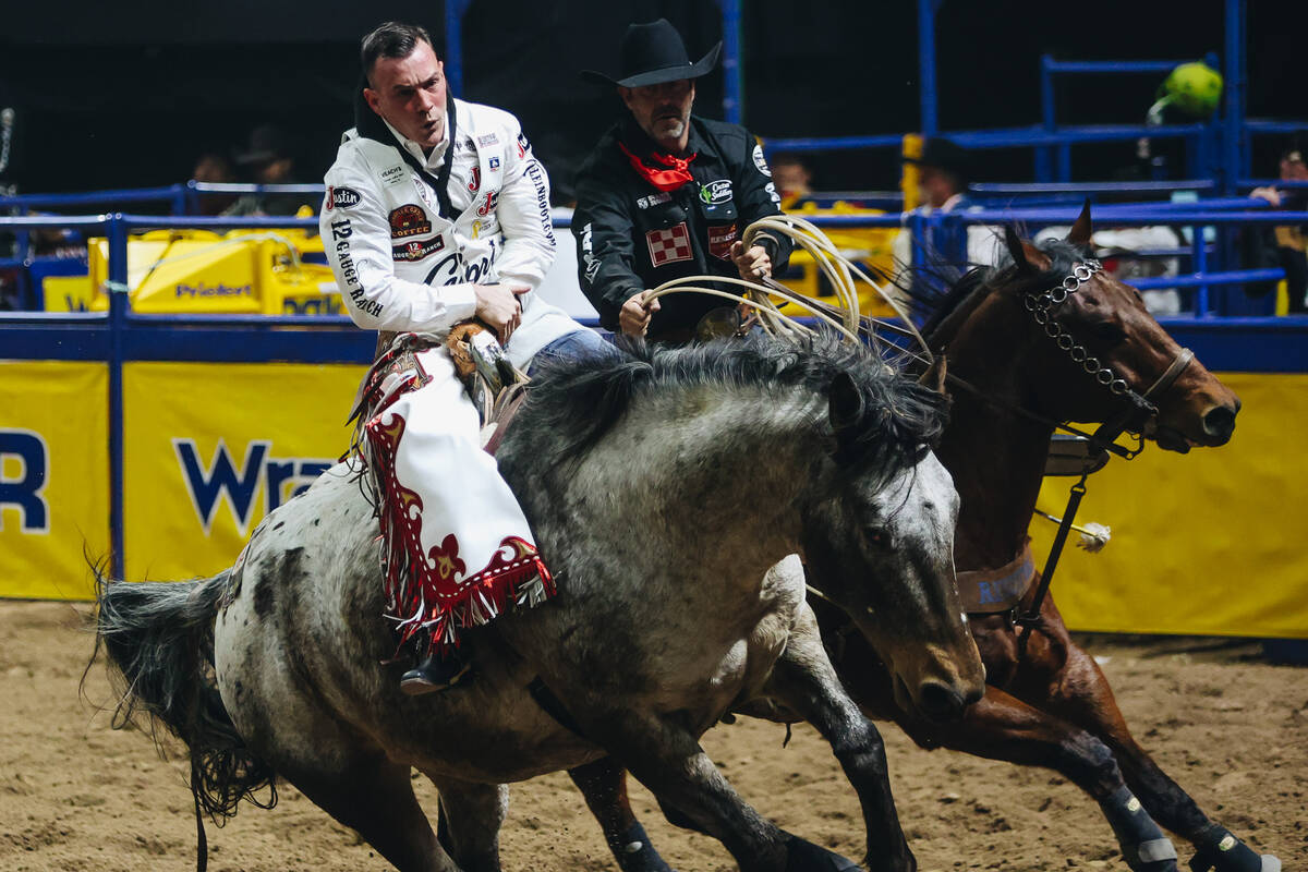 Tim O’Connell is assisted by a pickup rider after his ride during the first go-round the Nati ...