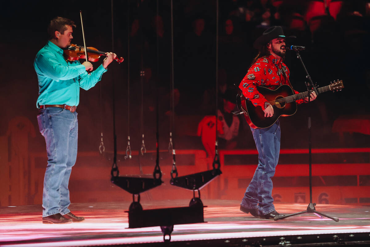 Country singer Ian Munsick performs his song “Long Live Cowgirls” during the National Final ...