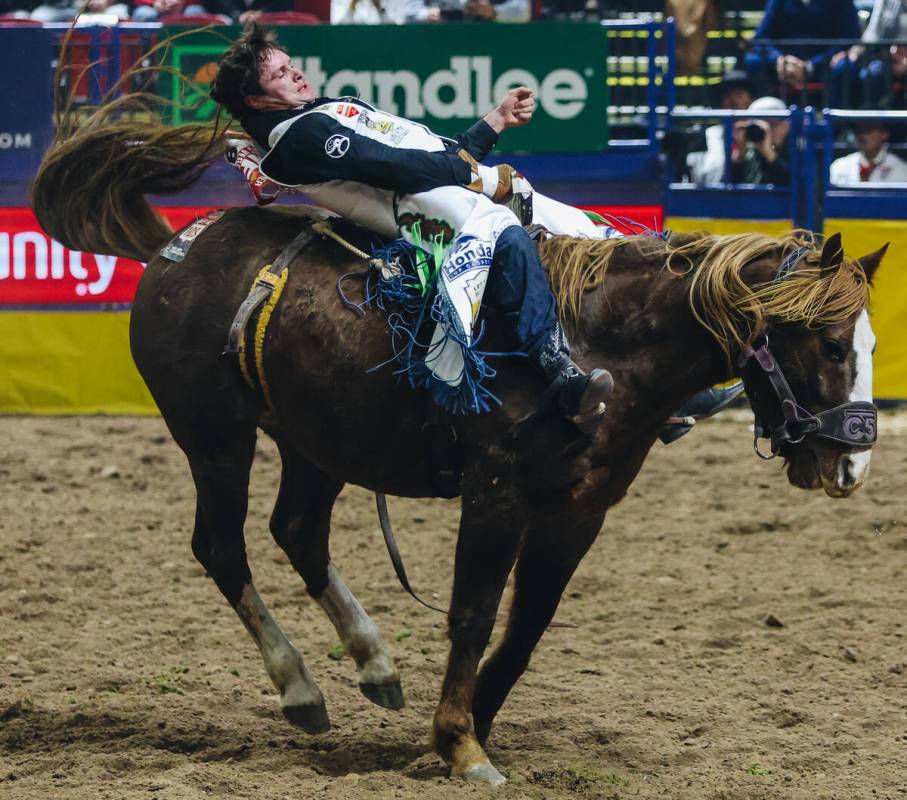 Cole Reiner rides She-La during the first go-round of bareback riding at the National Finals Ro ...