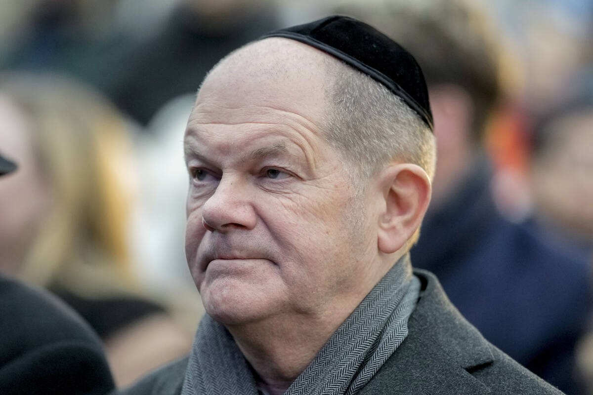 German Chancellor Olaf Scholz attends the ceremony to light the first candle of Hanukkah menora ...