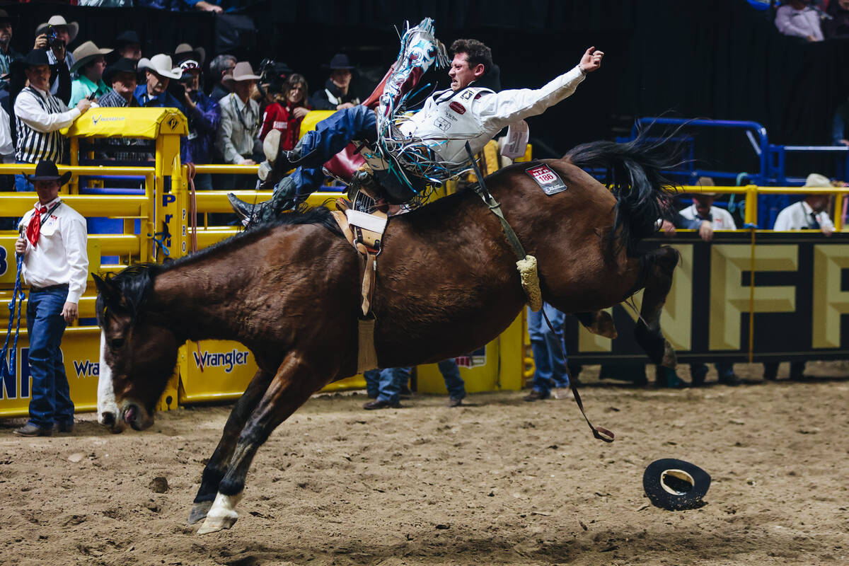 Kade Sonnier rides Irish Eyes during round one of bareback riding at NFR in the Thomas & Ma ...