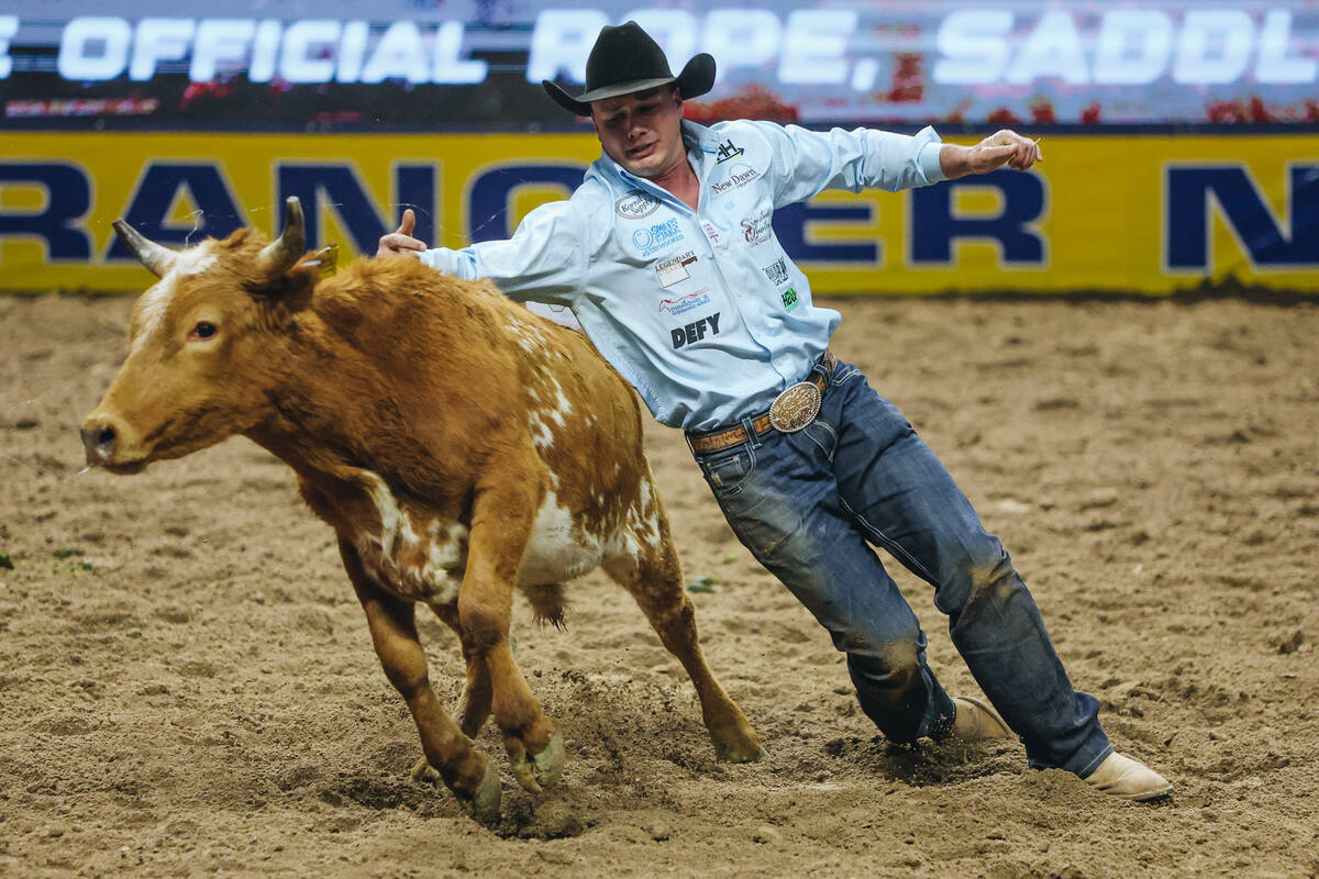 Bridger Anderson loses the steer during the steer wrestling portion of NFR at the Thomas & ...