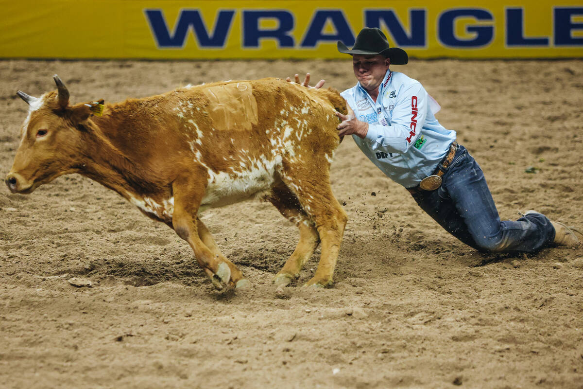 Bridger Anderson loses the steer during the steer wrestling portion of NFR at the Thomas & ...