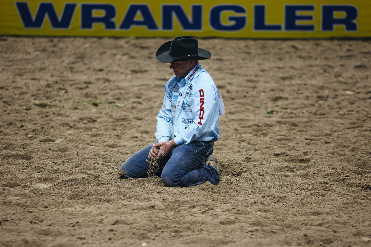 Bridger Anderson takes a moment to himself after losing hold of the steer during the steer wres ...