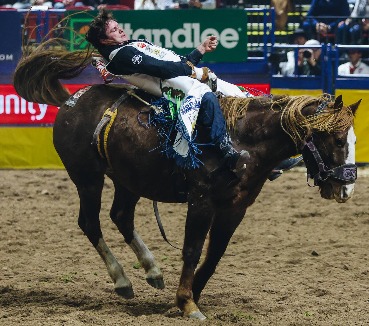 Cole Reiner rides She-La during round one of bare back riding at NFR in the Thomas & Mack C ...