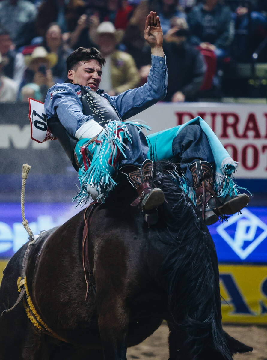 Jess Pope rides True Grit during round one of bareback riding at NFR in the Thomas & Mack C ...