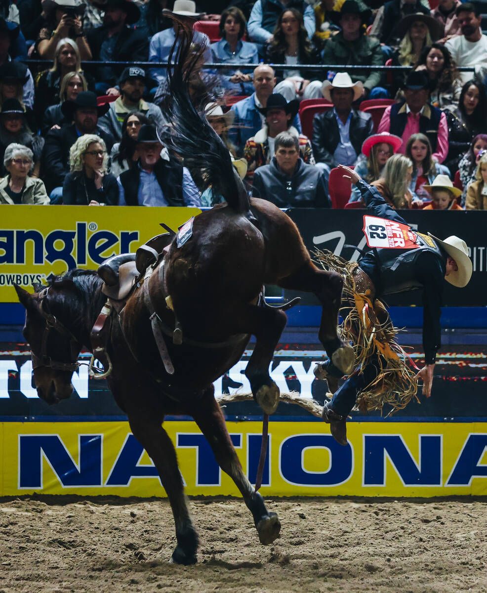 Brody Cress gets bucked off of Rubels the horse during the National Finals Rodeo at the Thomas ...