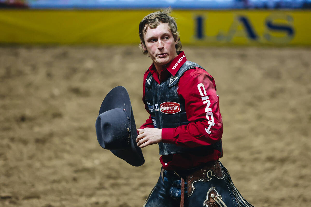 Ryder Sanford walks off after riding Spotted Blues during the National Finals Rodeo at the Thom ...