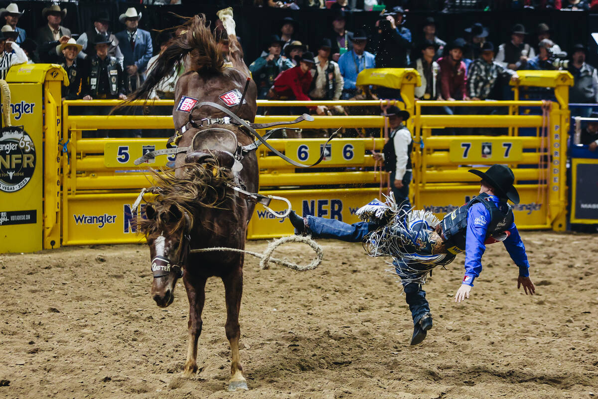 Ryder Wright gets bucked off of Trump Card during the National Finals Rodeo at the Thomas & ...