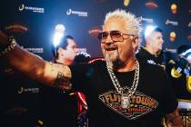Guy Fieri waves to fans during a grand opening event for his new restaurant on the Strip on Fri ...