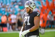 Las Vegas Raiders tackle Justin Herron (71) stands on the field before an NFL football game aga ...