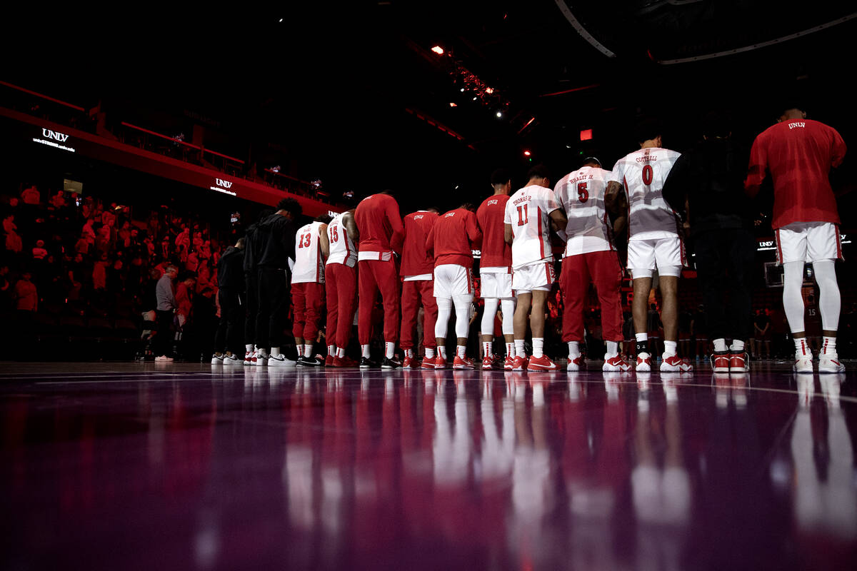 The UNLV Rebels take a moment of silence for the shooting victims at their school before an NCA ...