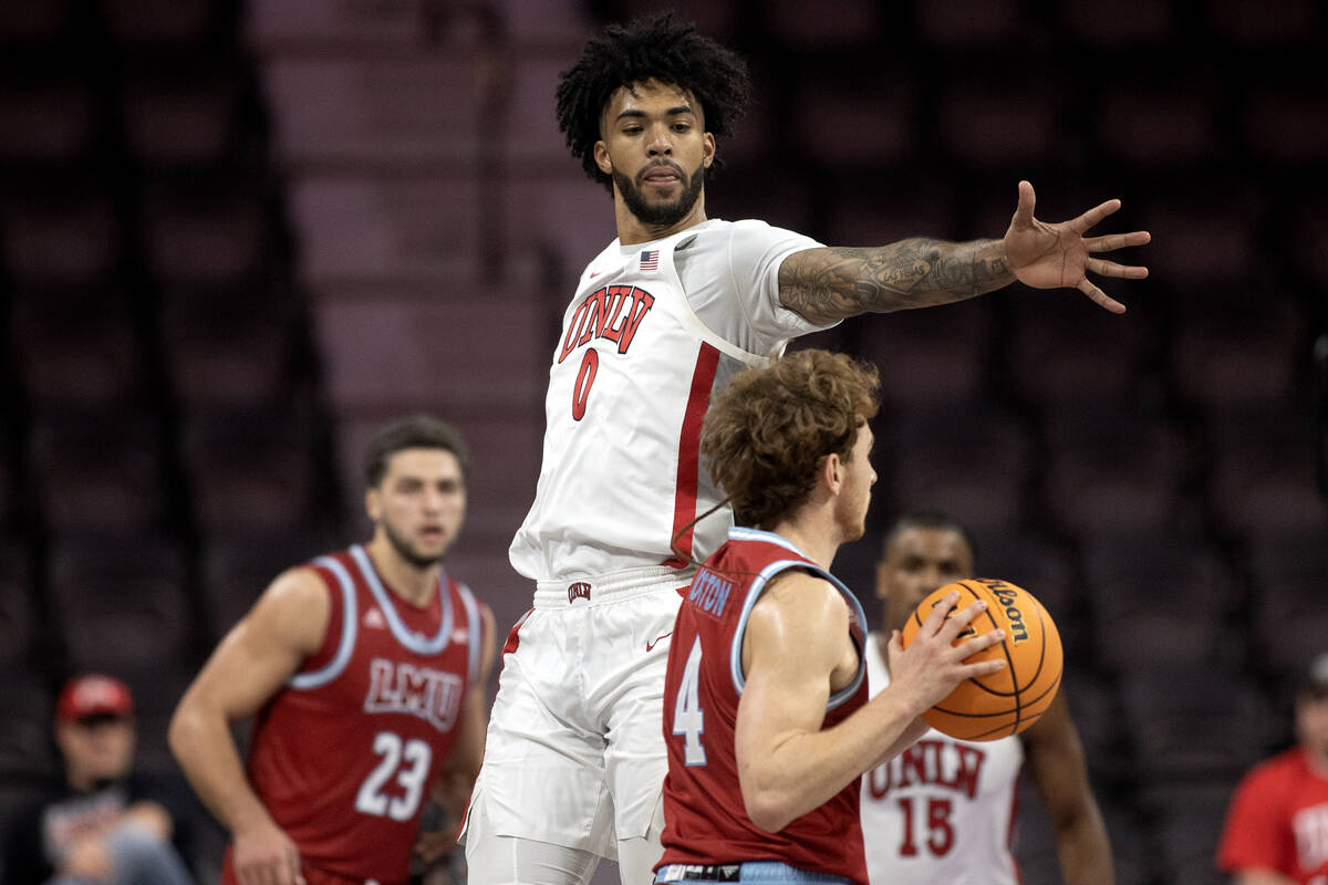 UNLV Rebels forward Isaiah Cottrell (0) jumps to block against Loyola Marymount Lions guard Wil ...