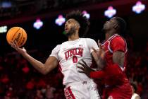 UNLV Rebels forward Isaiah Cottrell (0) loses control of the ball to Loyola Marymount Lions cen ...