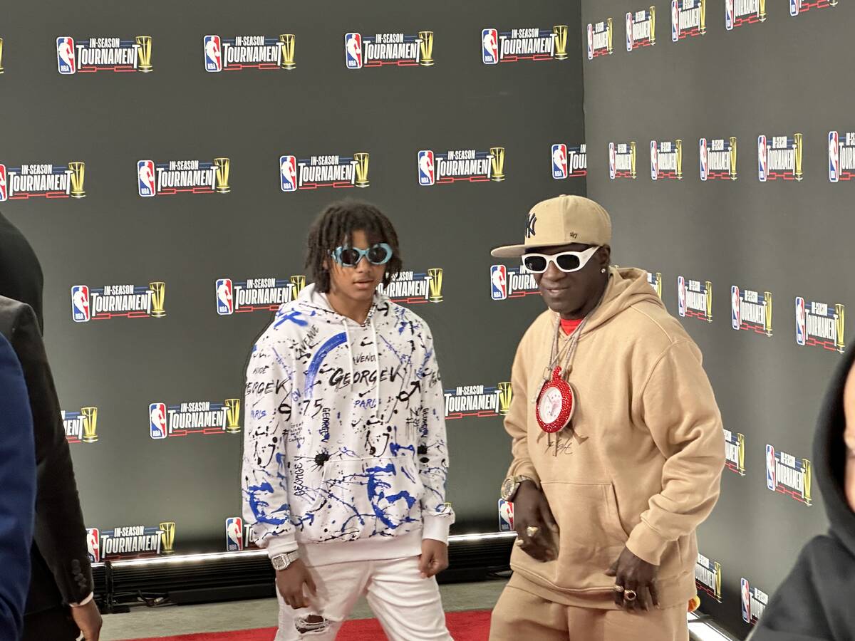 Flavor Flav and his son Karma are shown on the red carpet of the NBA In-Season In-Season Tourna ...