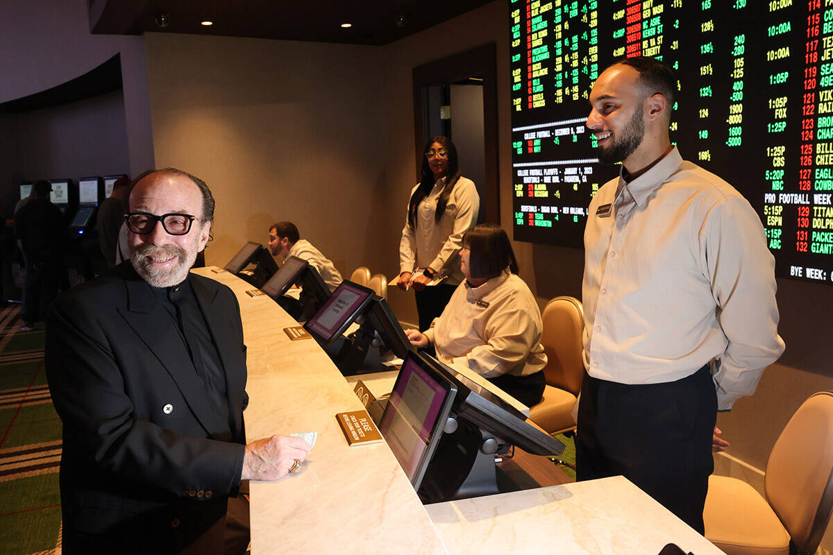 Bernie Yuman, longtime manager of Siegfried and Roy places the ceremonial first bet at the spor ...