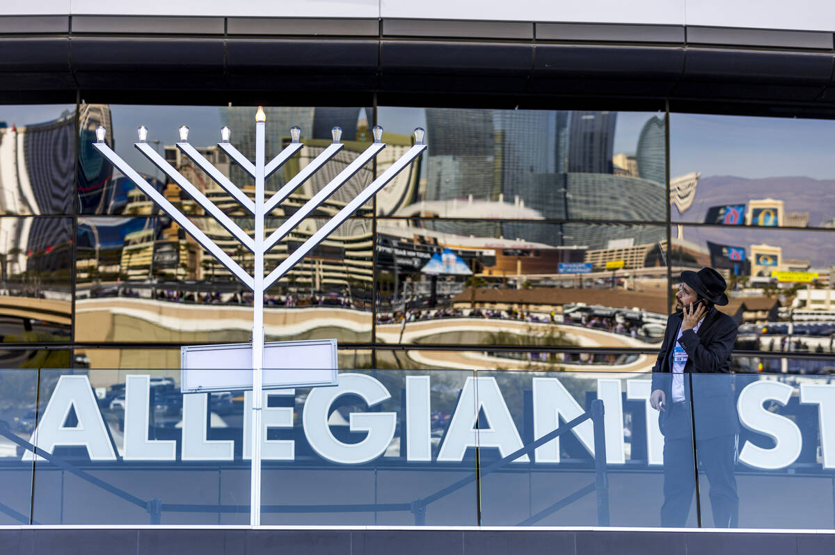 The menorah is already lit with 4 candles outside the stadium before the Raiders face the Minne ...