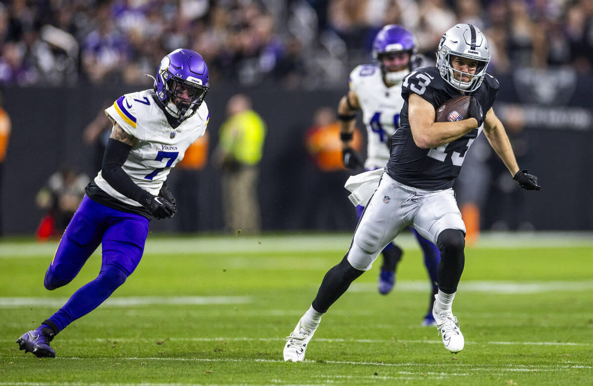 Raiders wide receiver Hunter Renfrow (13) runs into open field after a reception against Minnes ...