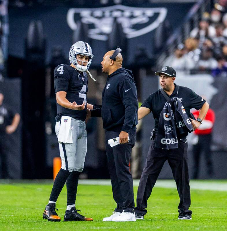 Raiders quarterback Aidan O'Connell (4) speaks with interim head coach Antonio Pierce against t ...